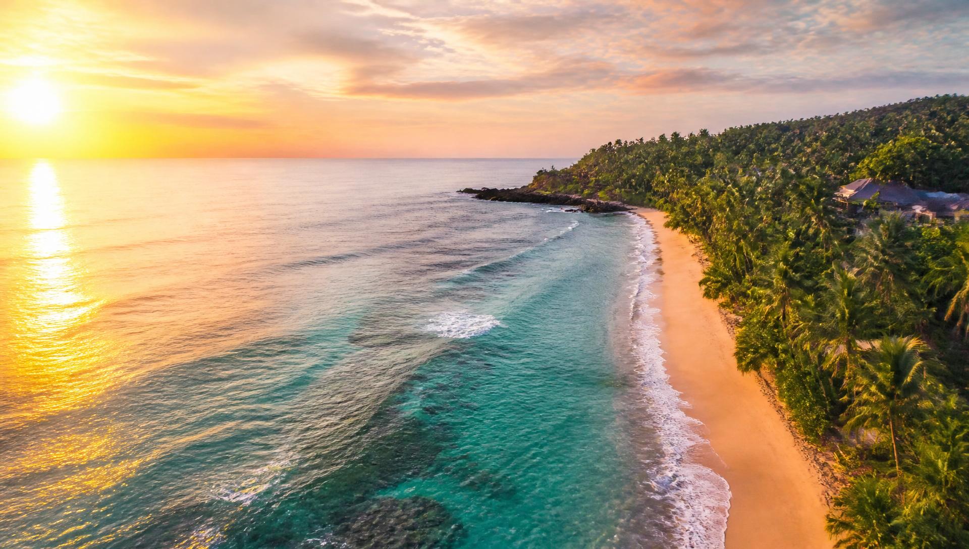 Aerial view of a tropical Sri Lankan coastline at sunset